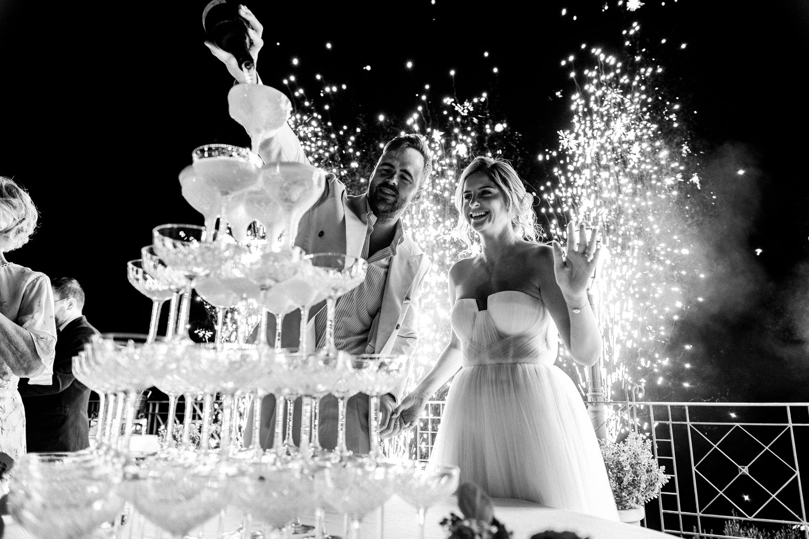 A champagne tower and sparklers at a Sicilian wedding