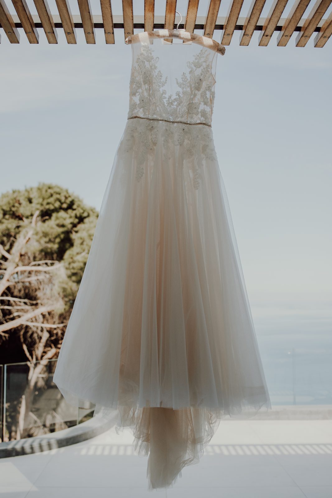 The gown, hung against the Cefalù sea