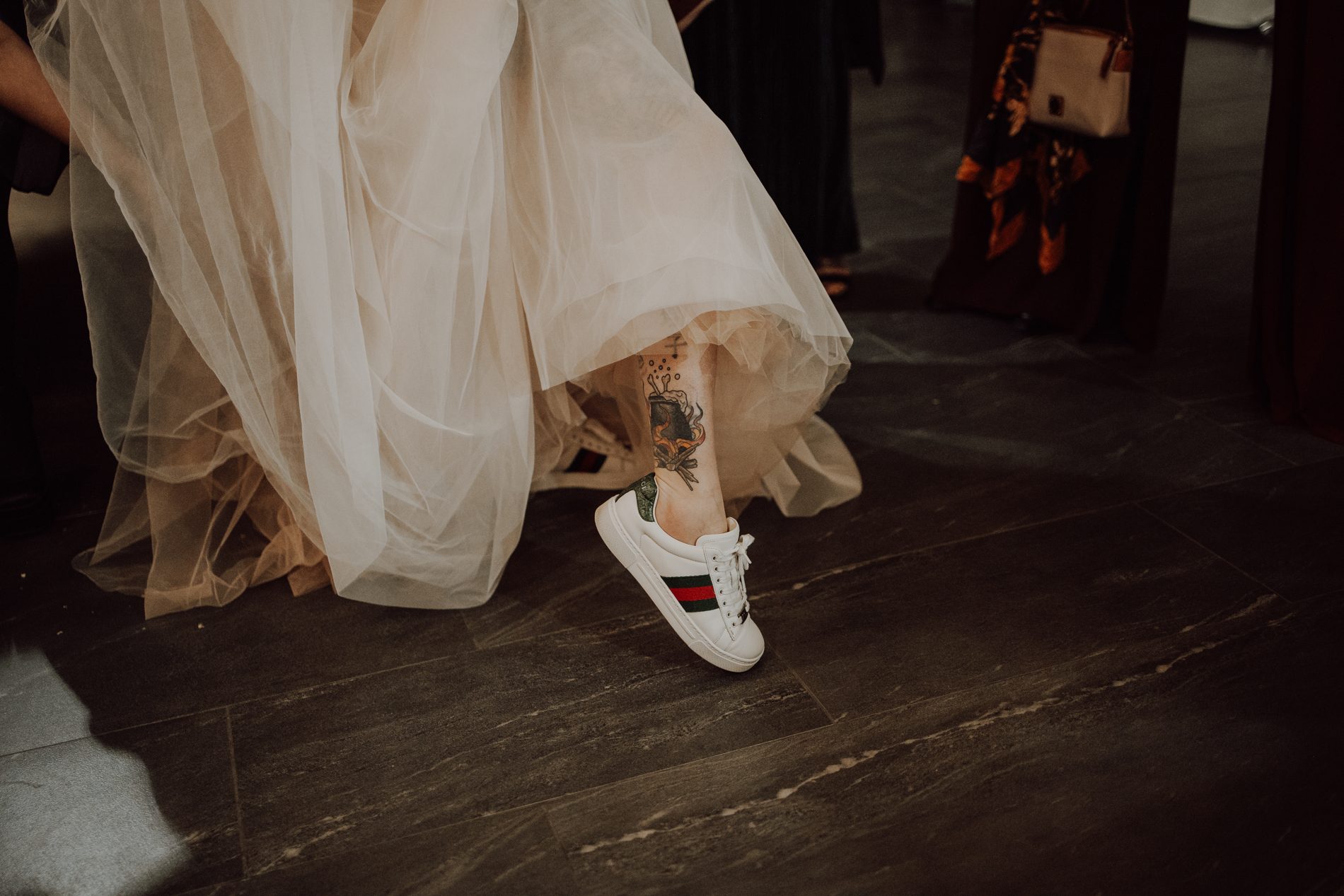 The switch to Gucci sneakers as the party got going