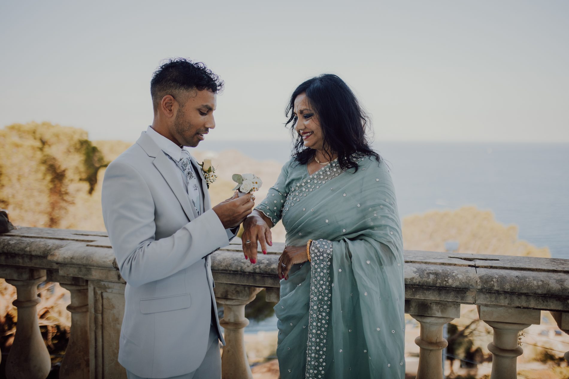 Pinning a corsage for family, the bay behind