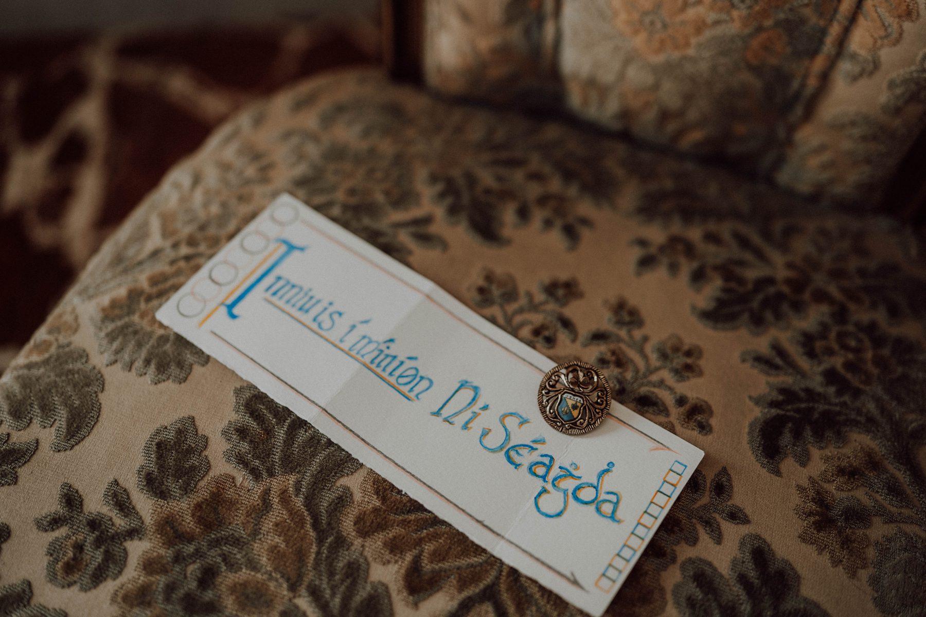 Hand-lettered name card with a wax seal