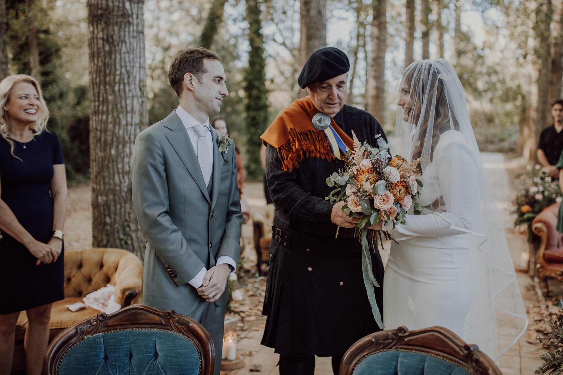 Exchanging vows with the celebrant in the woodland