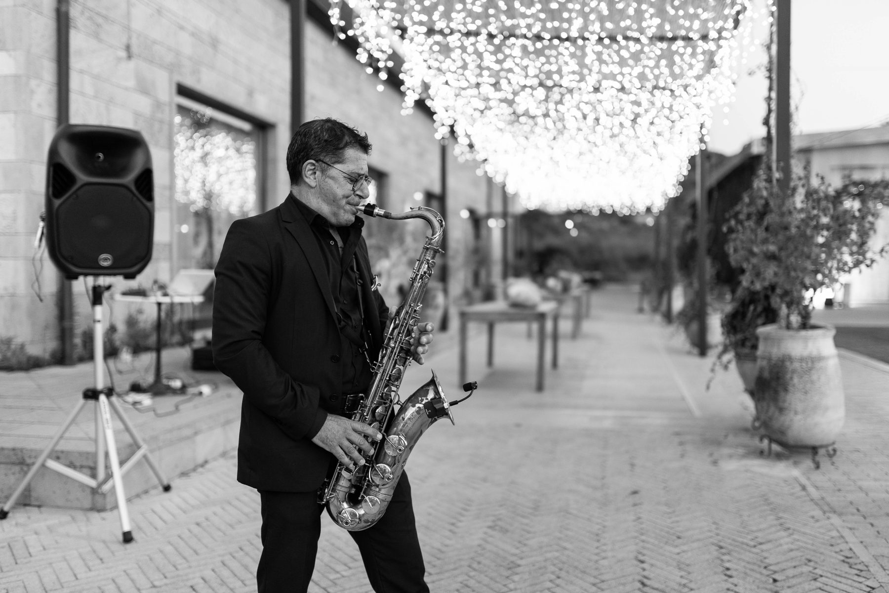 Live saxophone under the string lights