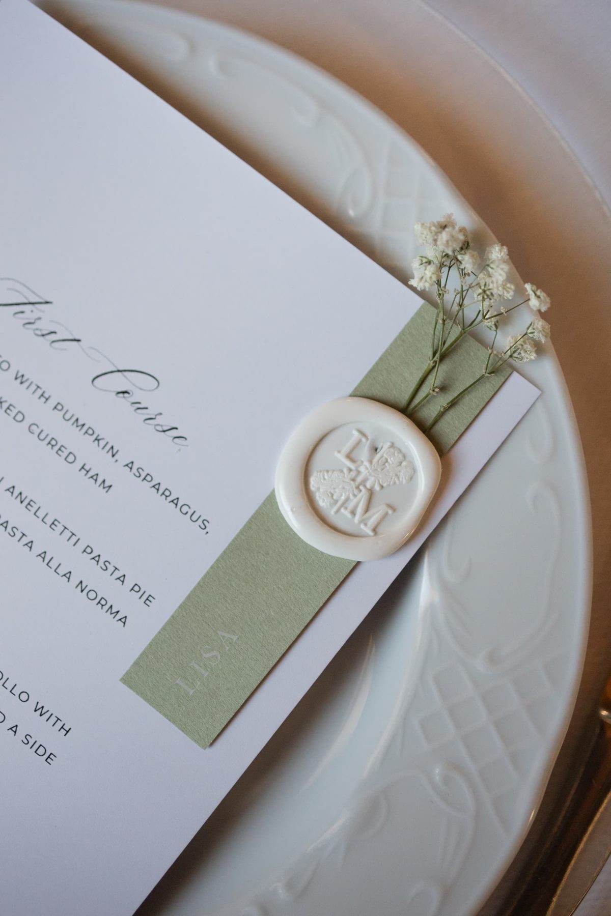 Wedding menu with wax seal and sage green place card