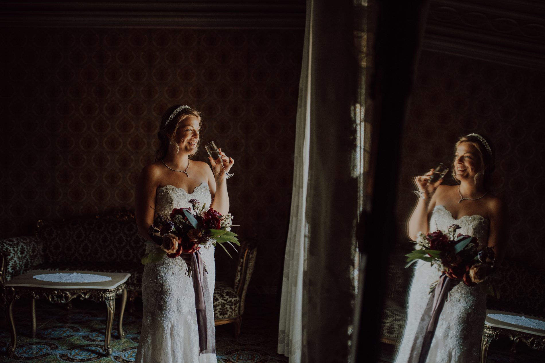 A glass of champagne, caught in the mirror