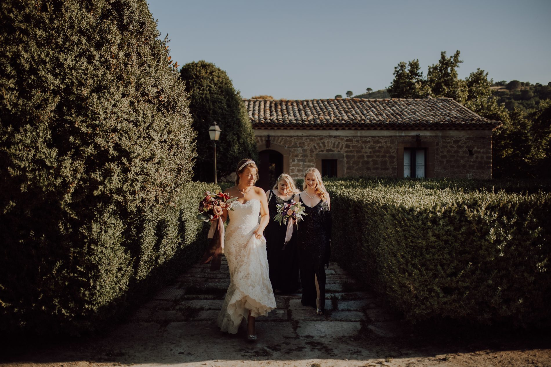 The walk to the ceremony, bridesmaids in black