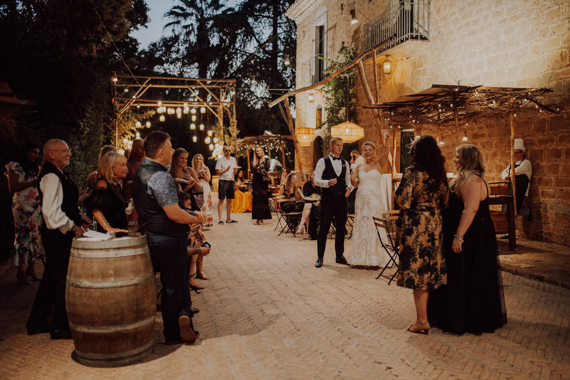 Guests gather as the light drops over the masseria