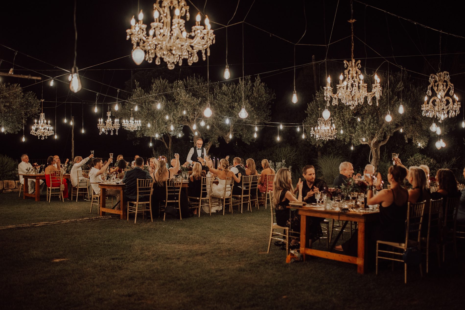 Dinner under vintage chandeliers and candlelight