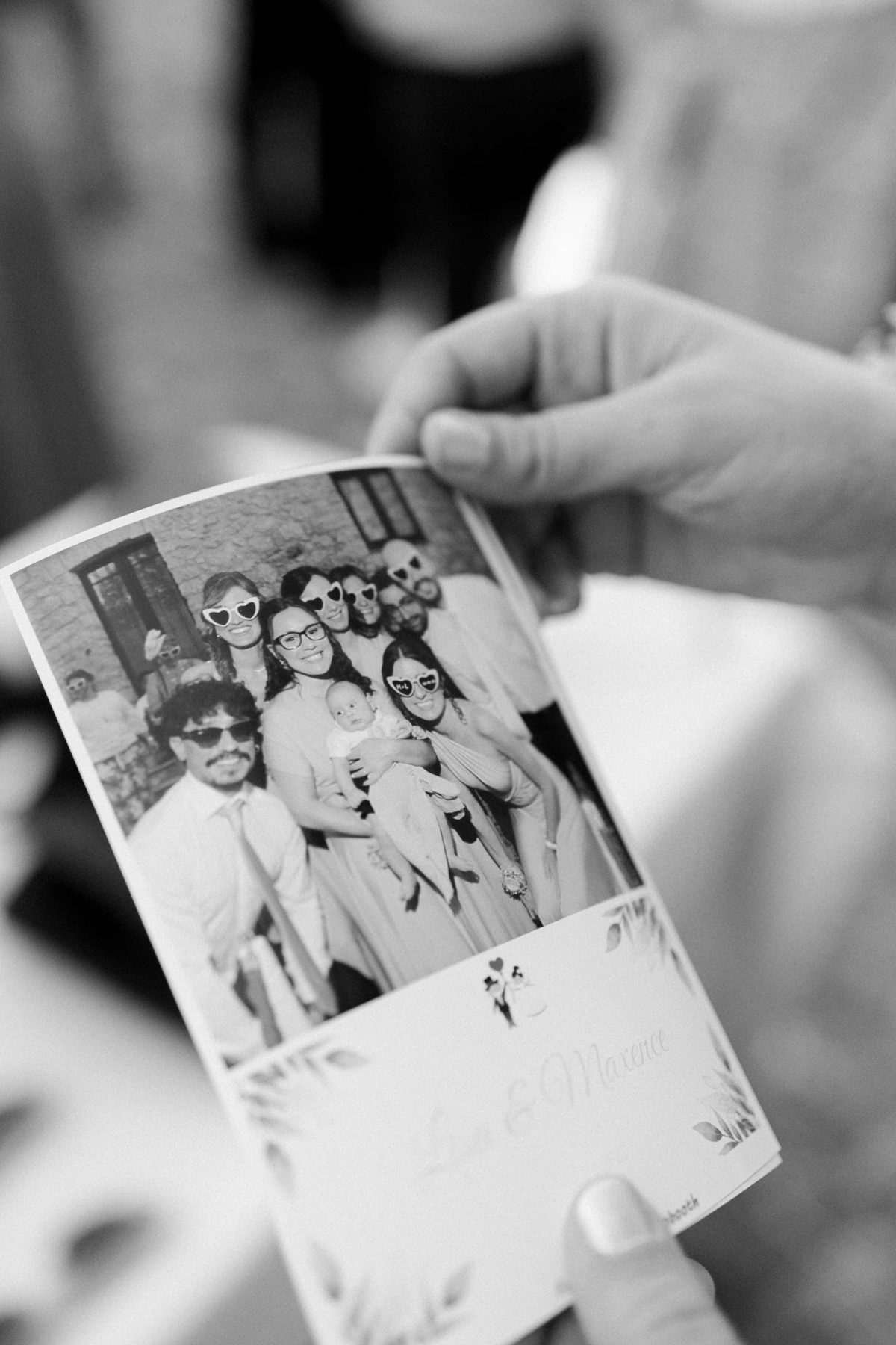 Black and white photobooth print with the wedding party